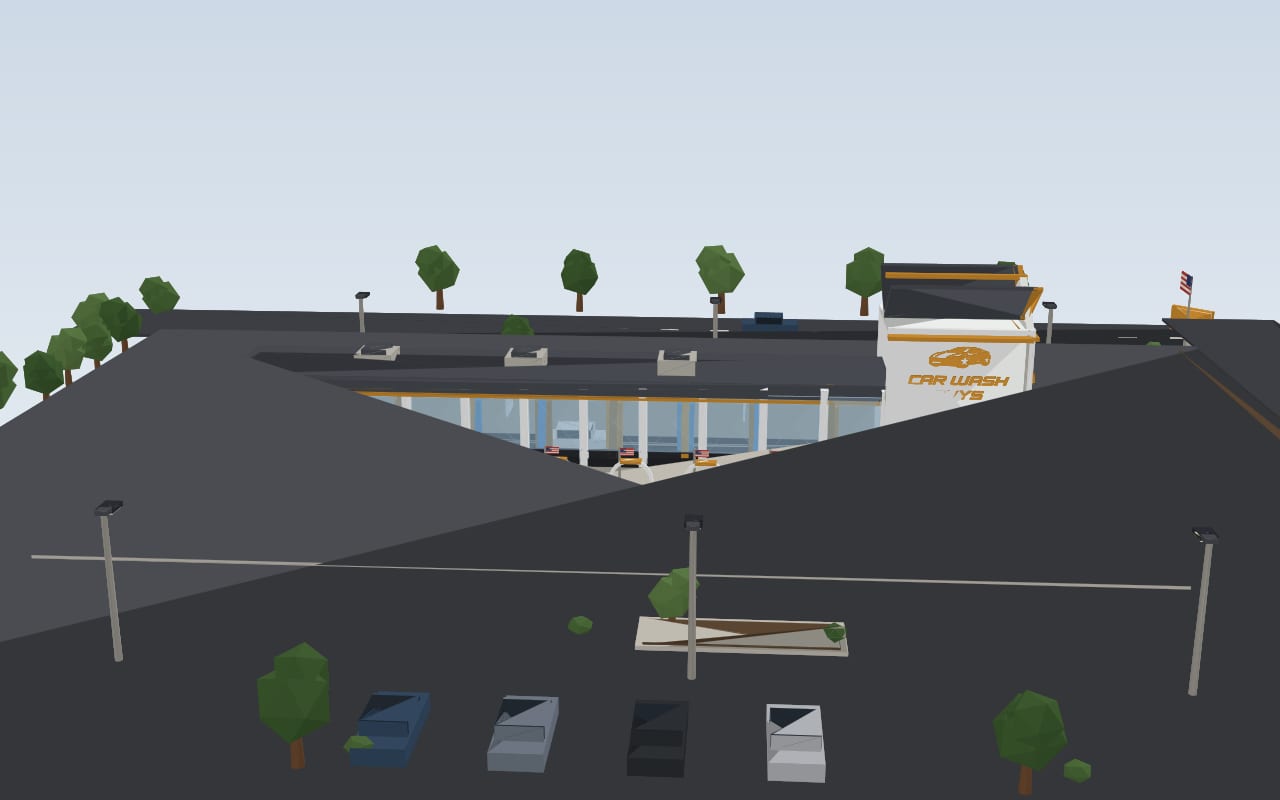 The gabled corner tower and wash exit with the gold Car Wash Guys logo.
